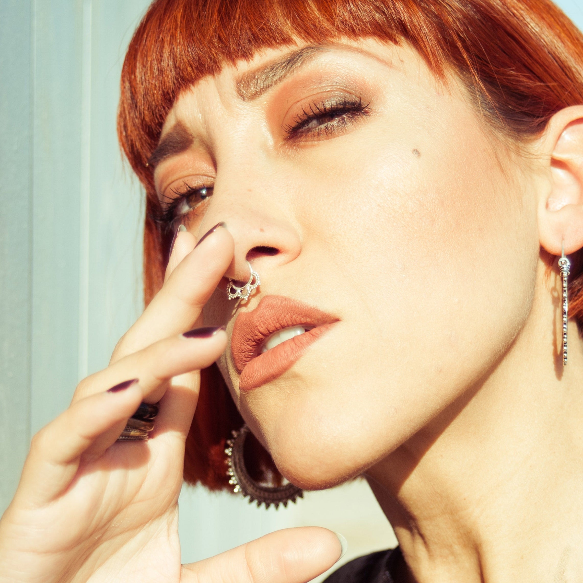 Loto septum piercing