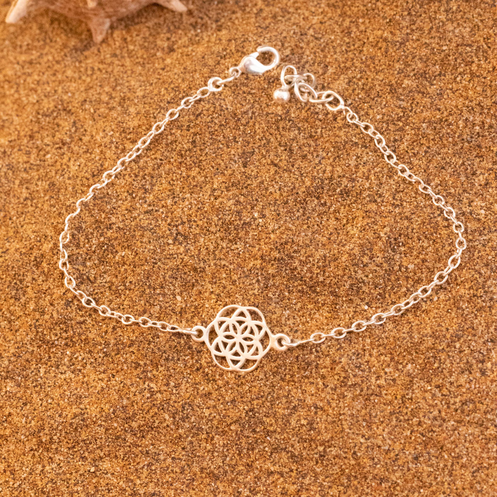 pulsera Flor de la vida sobre arena